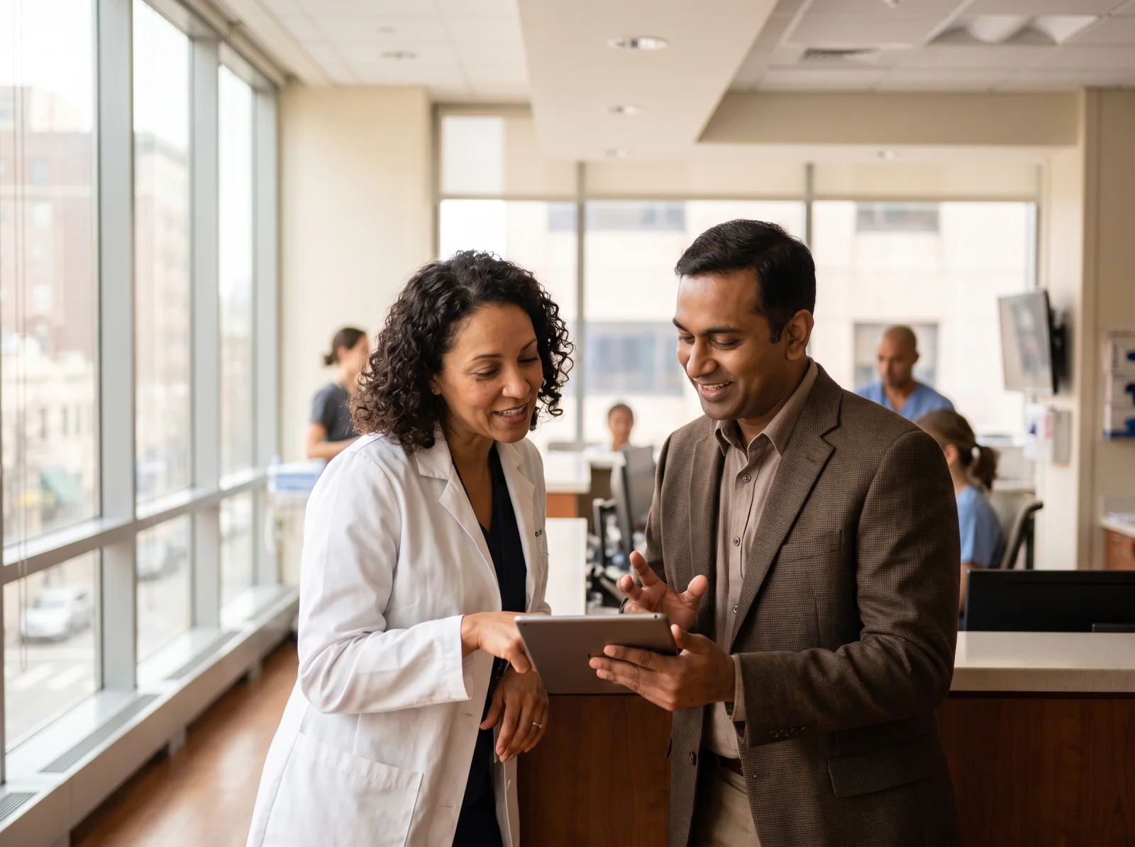 Journey Medical Group physician reviewing a resident's transfer with a hospital case manager